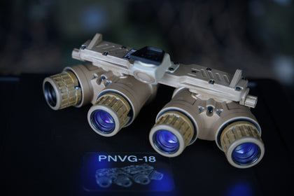 Representative tan ARGUS APNVG PNVG-18 quad-tube night vision device, rear eyepiece view; tube and mount configuration may vary