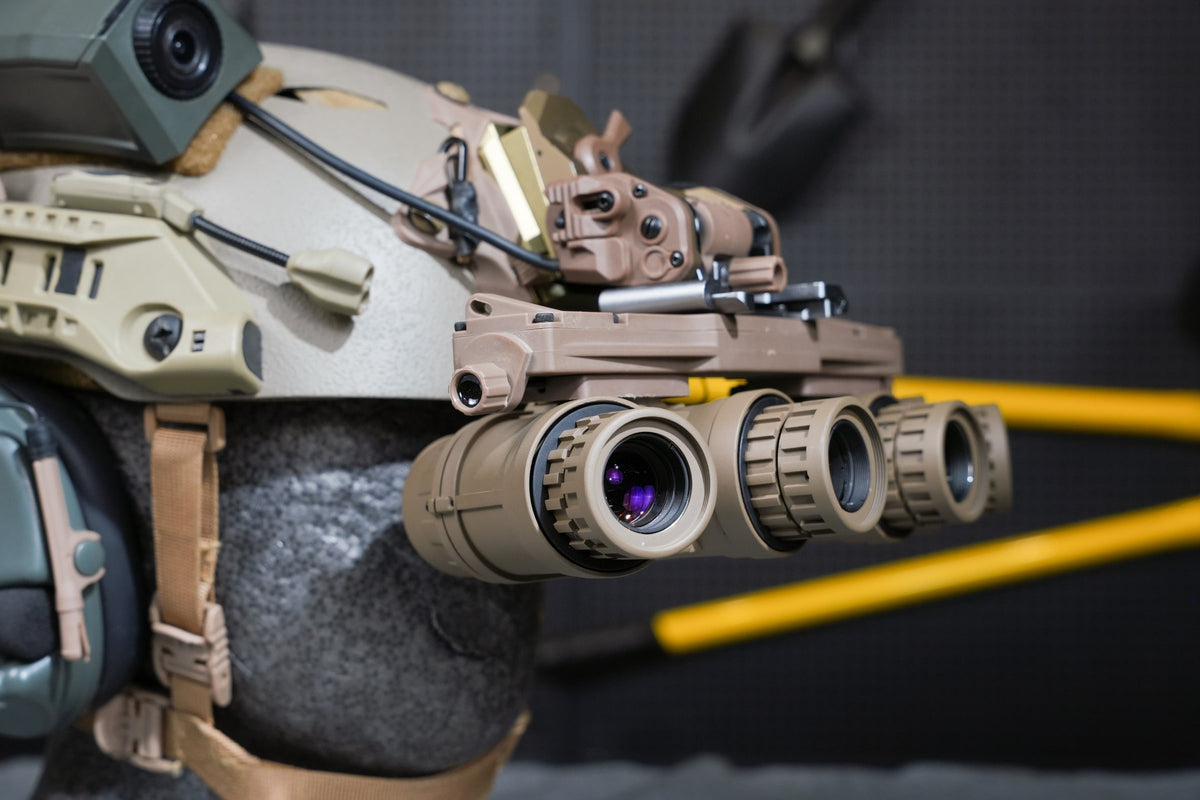 Tan Kaelor KPNVG-18 ANVIS panoramic NVG mounted on a helmet, angled view