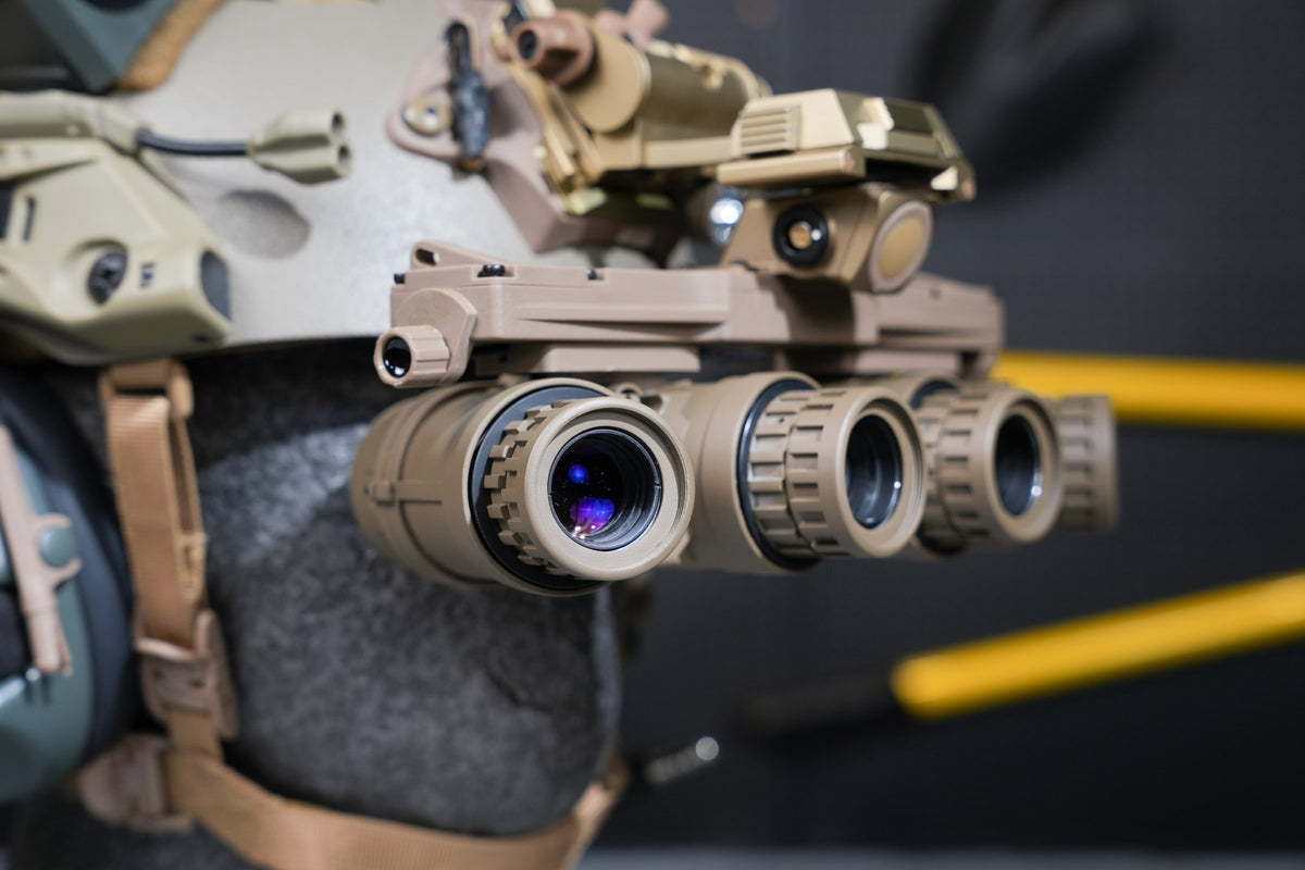 Tan Kaelor KPNVG-18 dovetail panoramic NVG mounted on a helmet, angled view