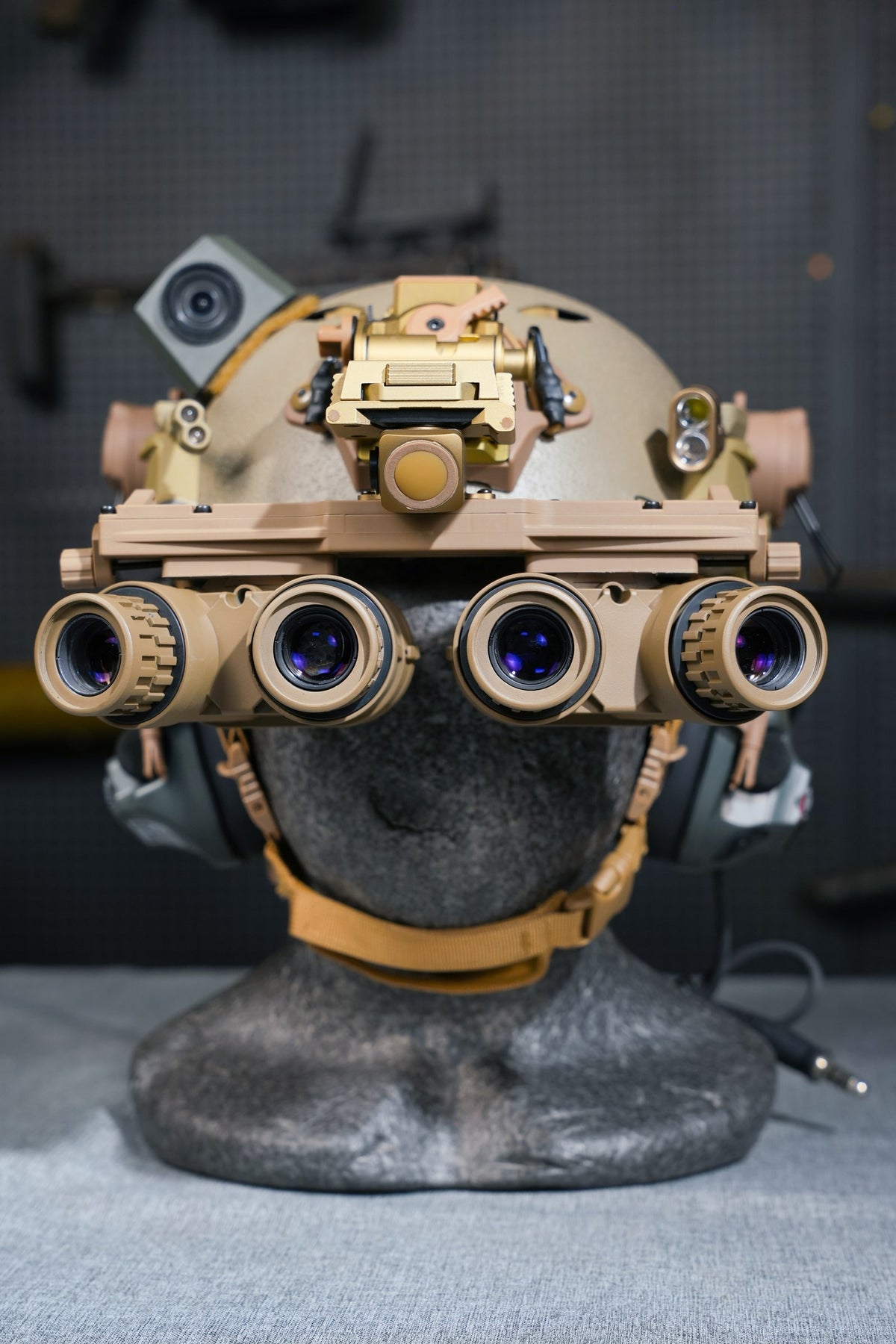 Tan Kaelor KPNVG-18 dovetail panoramic NVG mounted on a helmet, front view