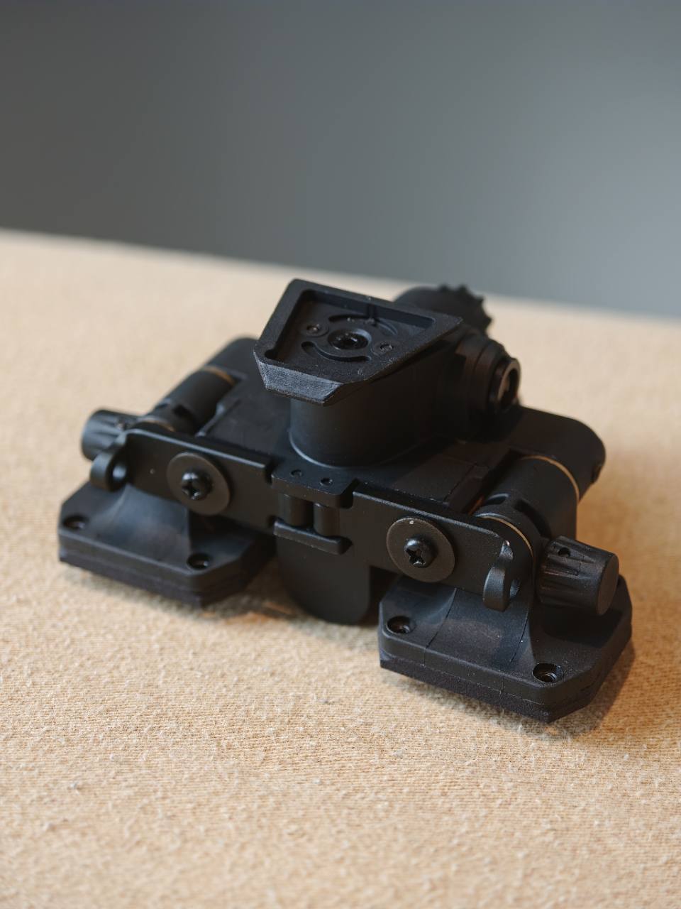 Rear view of polymer BNVD-1431 articulating bridge showing hinges and dovetail mount interface