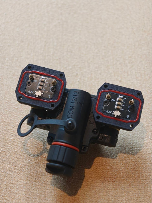 Underside of polymer 1431 articulating bridge showing left and right two-contact pod interfaces