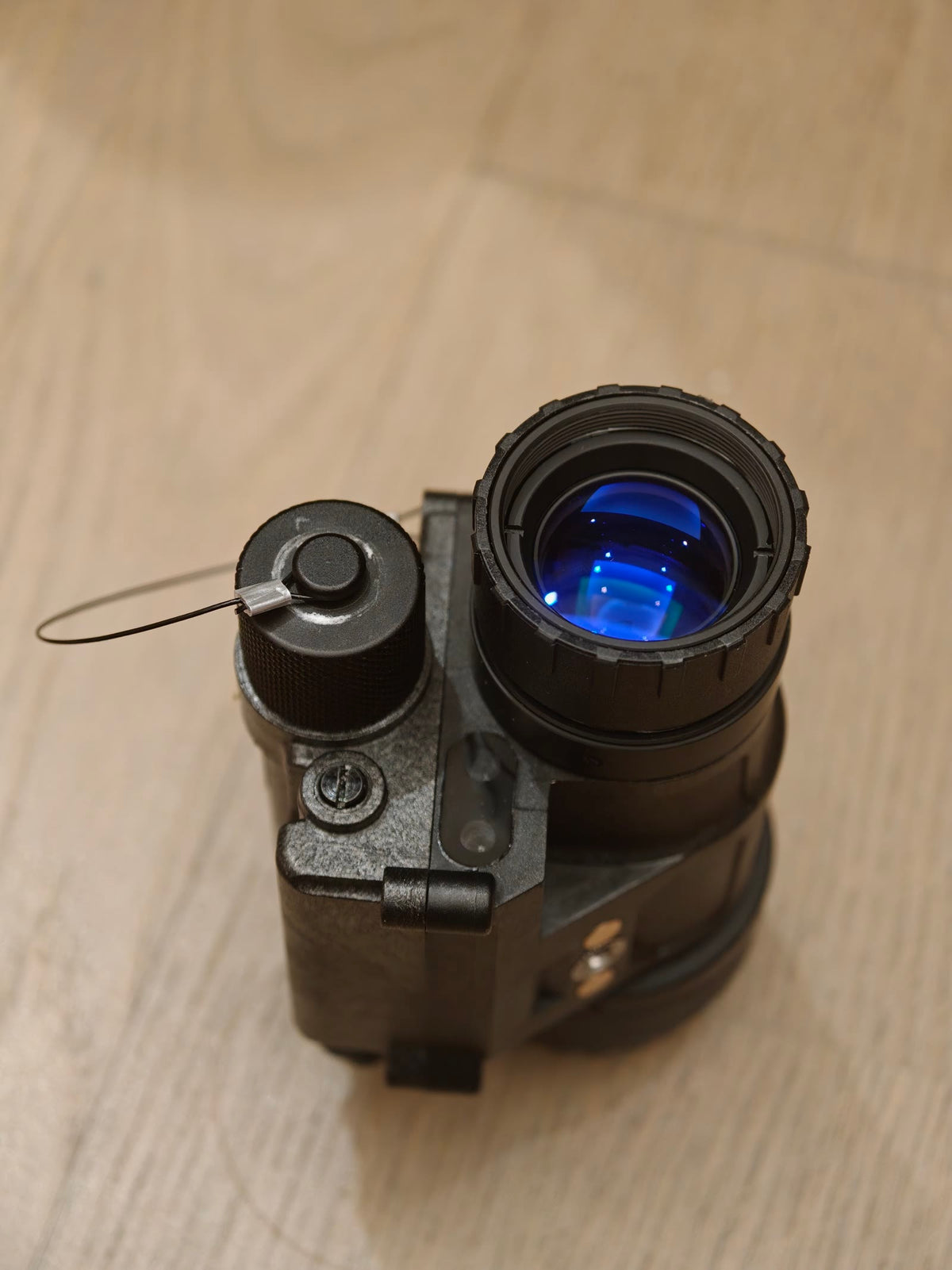 Reference photo of the PVS-14 monocular objective and front housing.