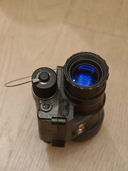Reference photo of the PVS-14 monocular objective and front housing.