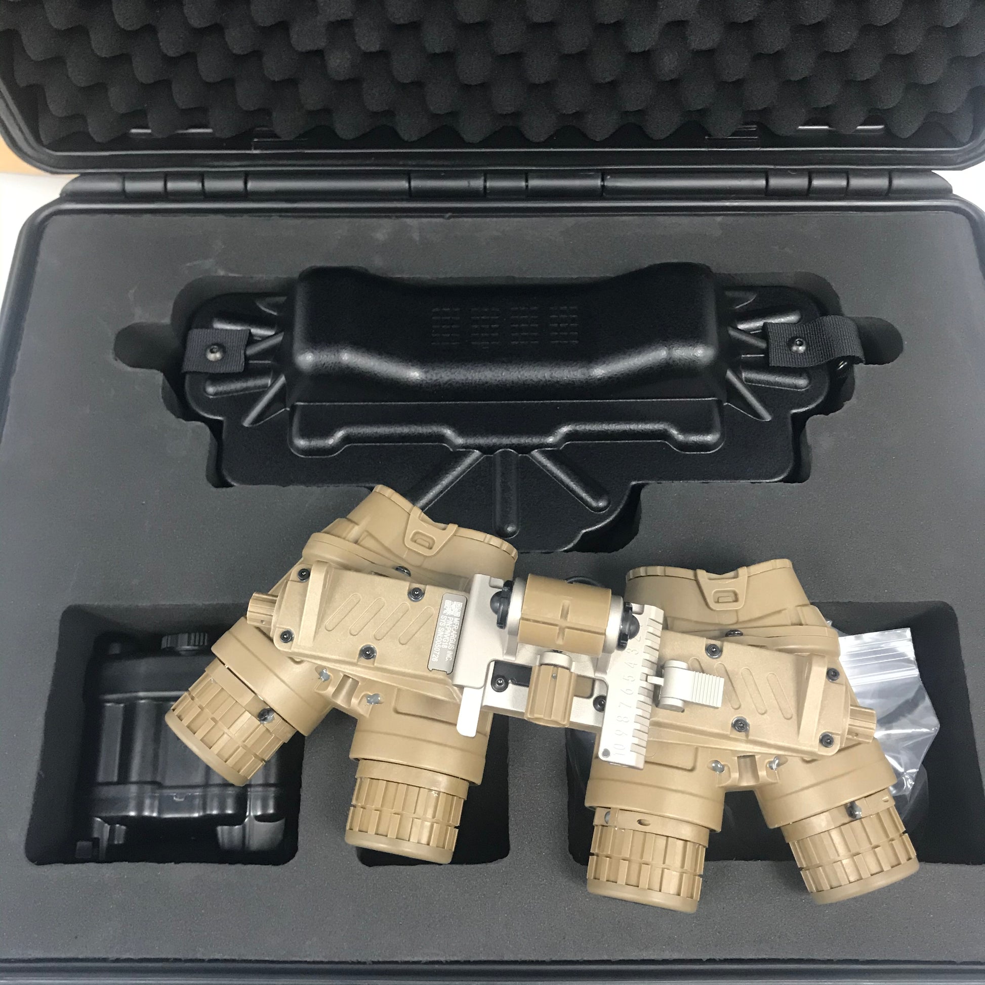 Tan ARGUS APNVG device, rear and eyepiece view in a fitted protective case