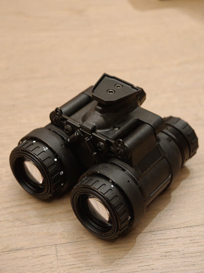 TC-X1 night vision binocular from right oblique angle, showing housing and top mount